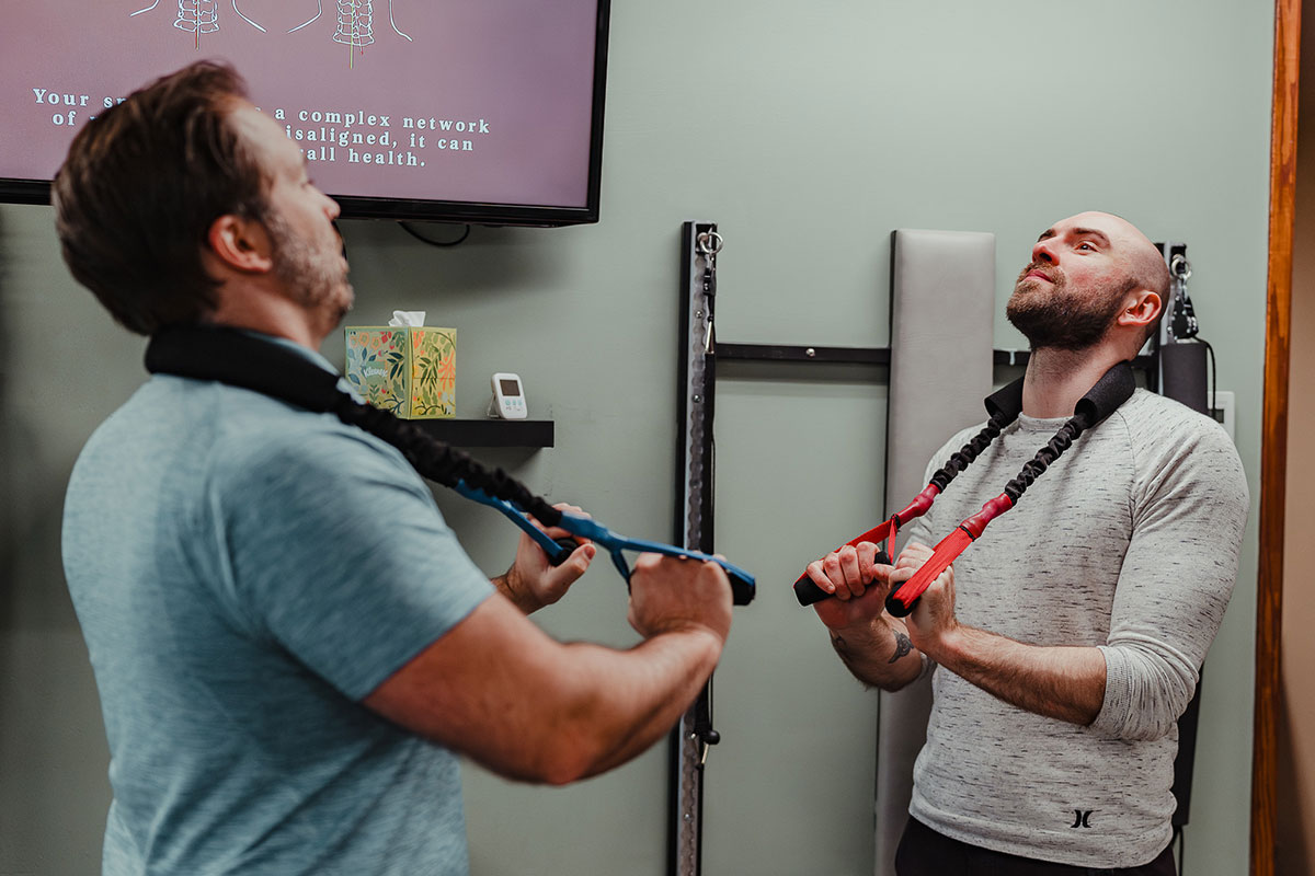 Dr. Cody Drake providing Whiplash treatment to male patient in Issaquah