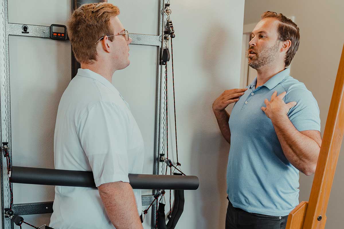 Dr. Cody Drake treating a male patient with disc decompression therapy