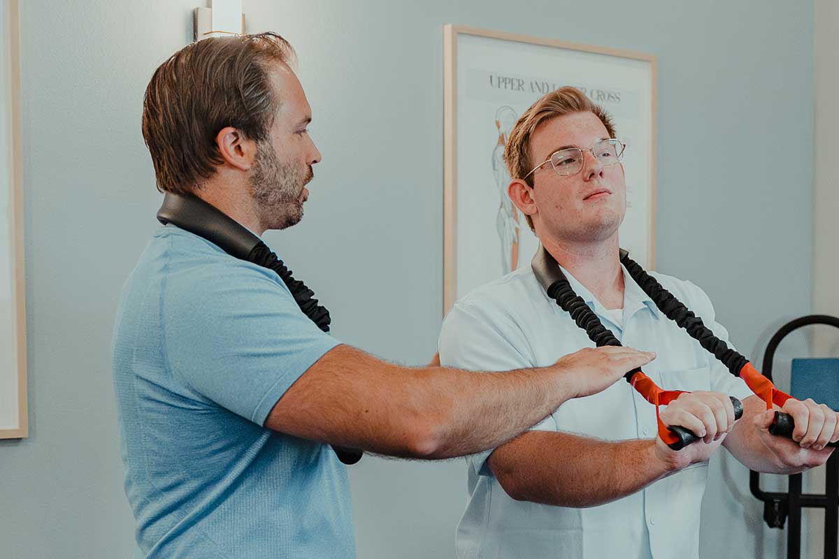 Dr. Cody Drake treating male patient with forward head posture in Issaquah